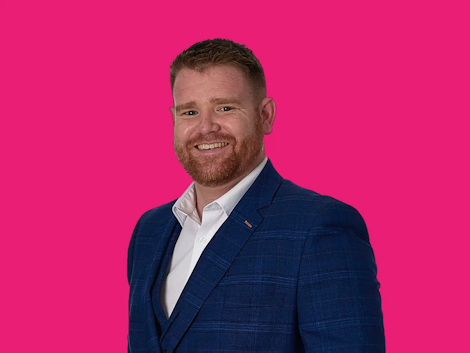 Alex Seabrook Headshot on Pink Background