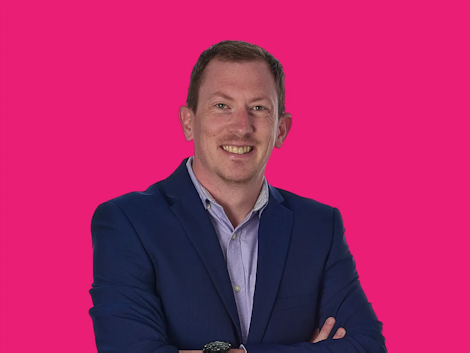 Chris Fowler Headshot on Pink Background